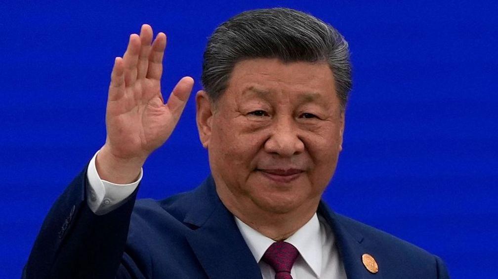 Chinese President Xi Jinping waves as he arrives at the opening ceremony for the World AI Conference on July 17, 2026 in Shanghai, China.