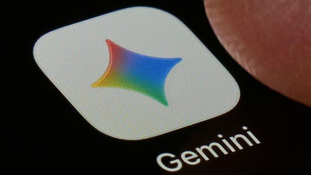 A close-up shot of the Gemini application on a black screen. The icon is a white square with a four-point star in Google's colours, under which the word 'Gemini' is printed.