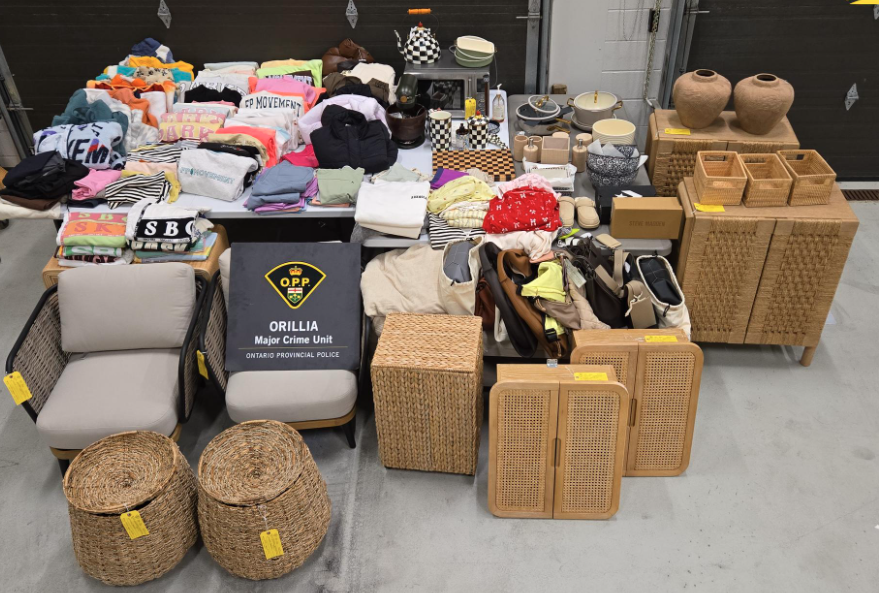 Items including clothes, woven baskets, chairs and ceramics arranged. The crest of Ontario Provincial Police and its Orillia Major Crime Unit are in the frame.