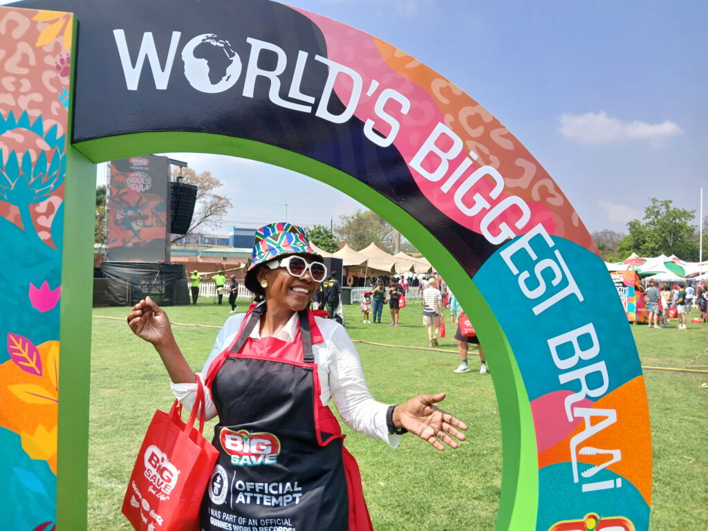 A woman poses at Loftus Versfeld Stadium in Pretoria where thousands of South Africans gathered on 24 September, 2026, to try and break the Guinness World Record for the biggest ever braai, or barbecue.