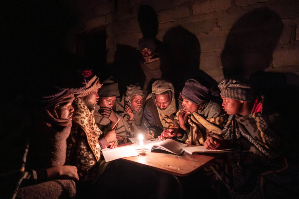 Shepherds attend a part-time night school near Mokhotlong, Lesotho. For many, these classes are the only form of education they can access.