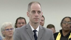 Caleb Flynn, accused of murdering his wife in February, sits before an Ohio judge in court
