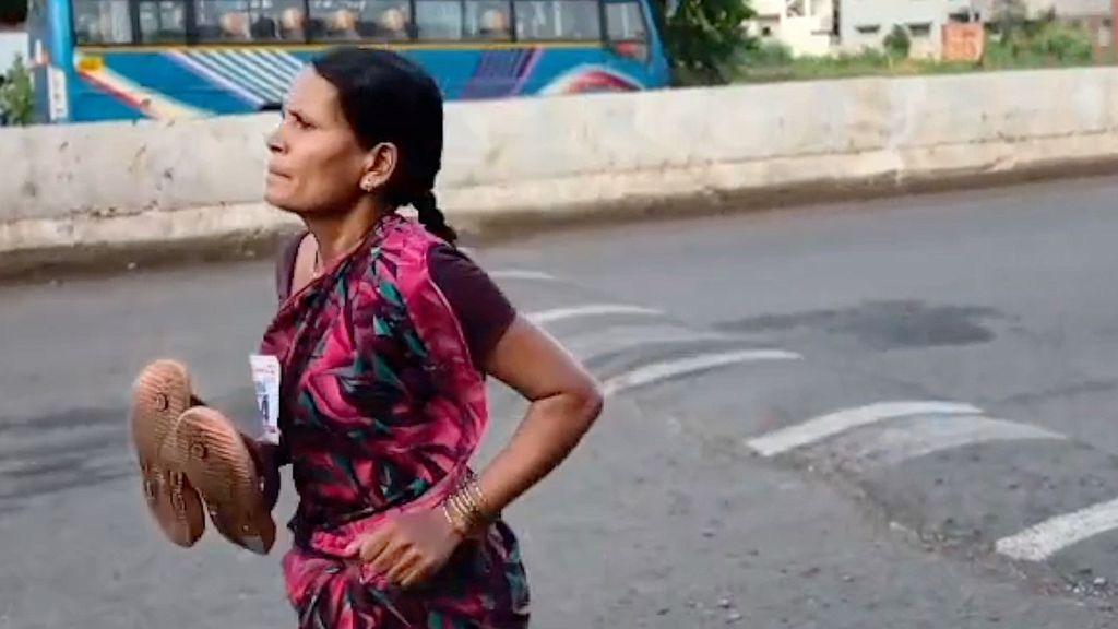 Wearing a long, flowing, colourful, patterned sari and carrying her slippers in her right hand, Ramabai Ranveer, 47, runs along an Indian avenue in the 3km Amrit Daud fun run.