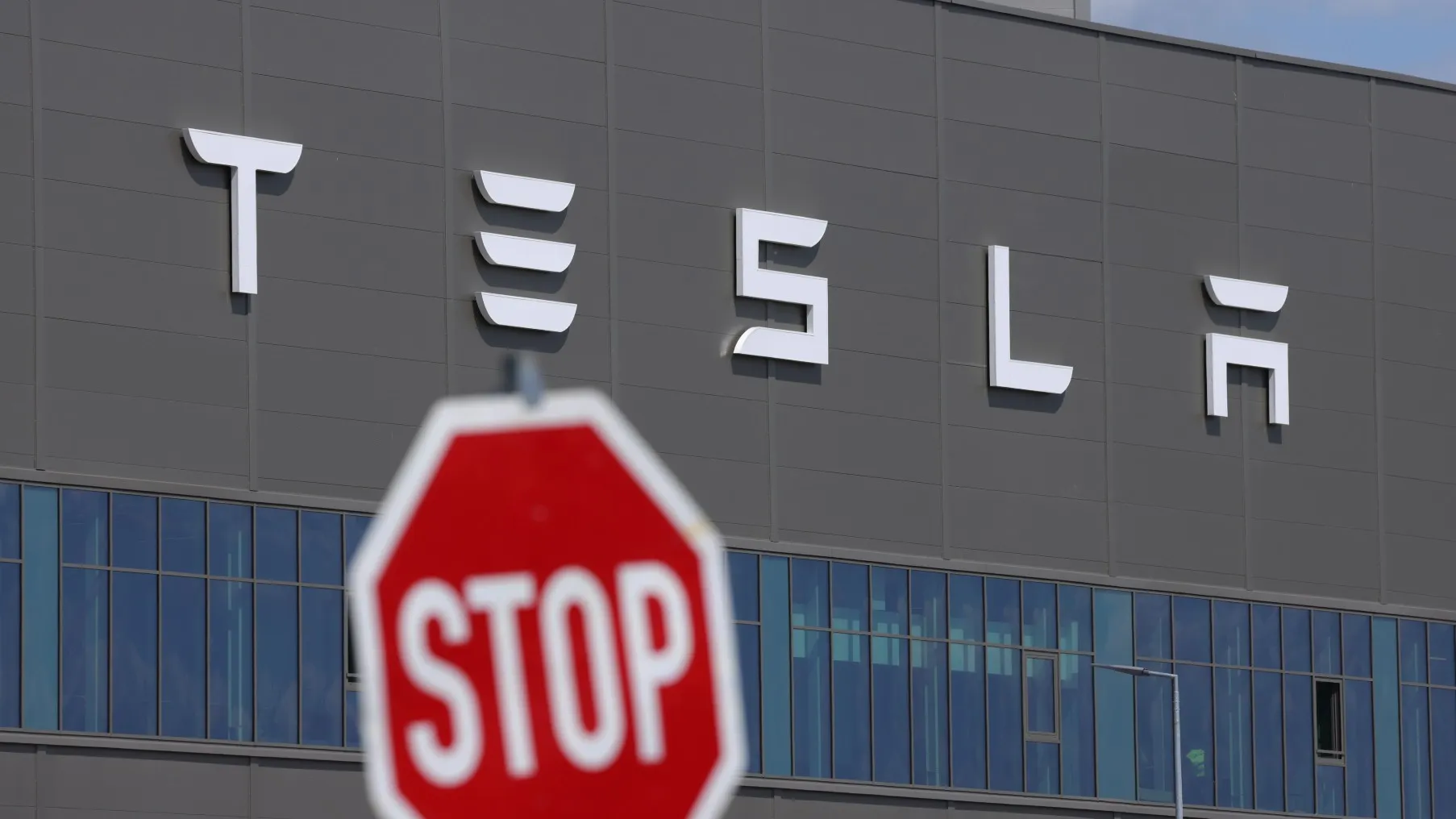 Tesla logo stop sign gettyimages