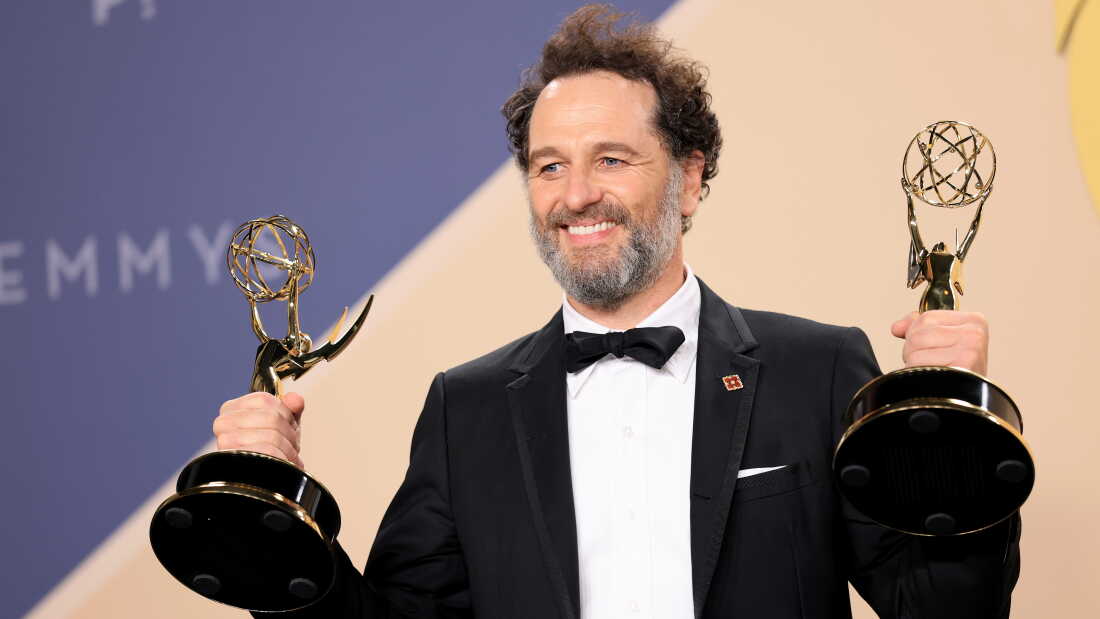 Matthew Rhys shows off his two lead actor awards on Monday night — for his performances in Widow's Bay and The Beast in Me.