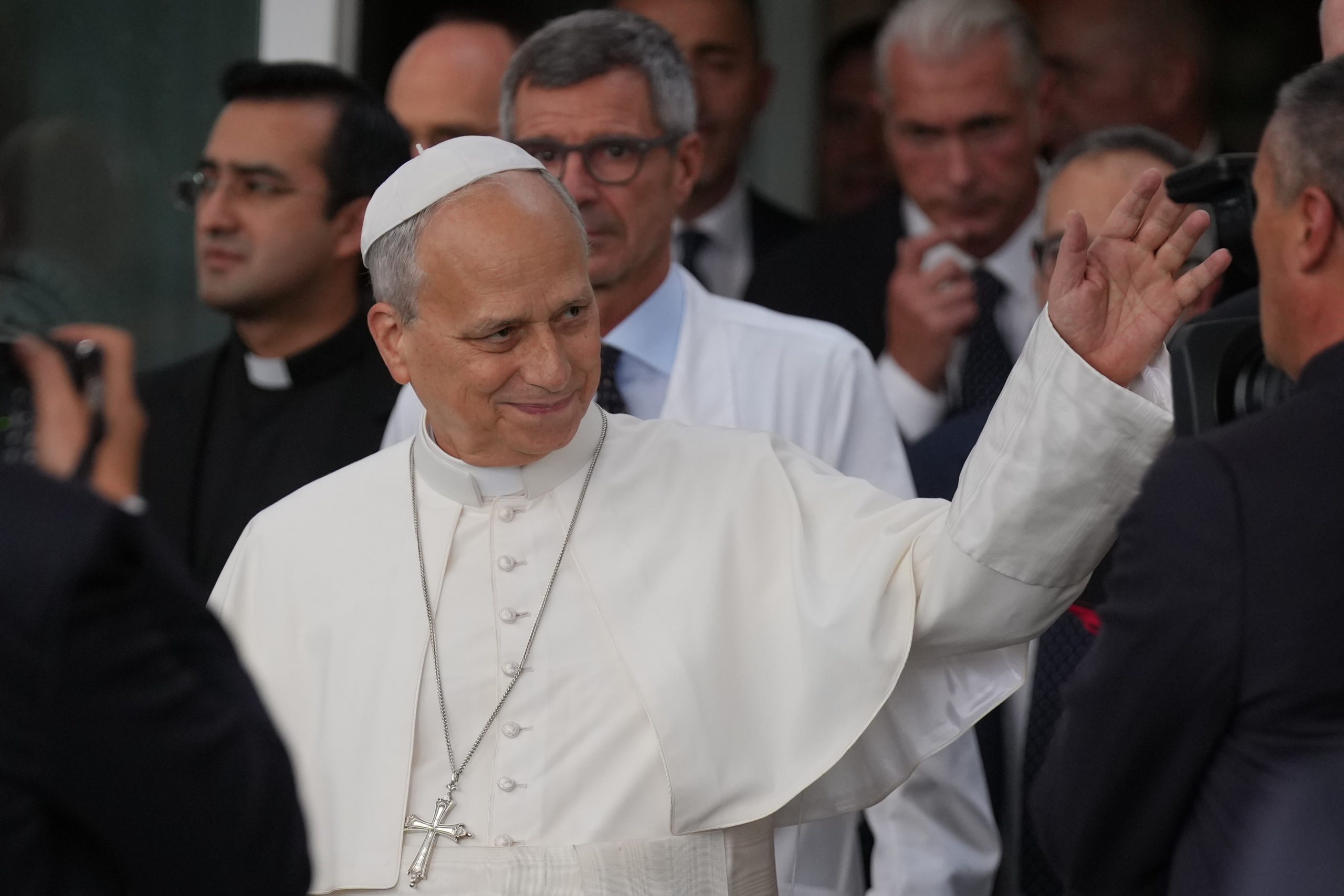Pope Leo XIV, followed by surgeon Stefano Margaritora, leaves Rome