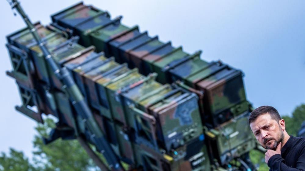 Ukrainian President Volodymyr Zelensky stands in front of a US-made Patriot anti-aircraft missile system. File photo