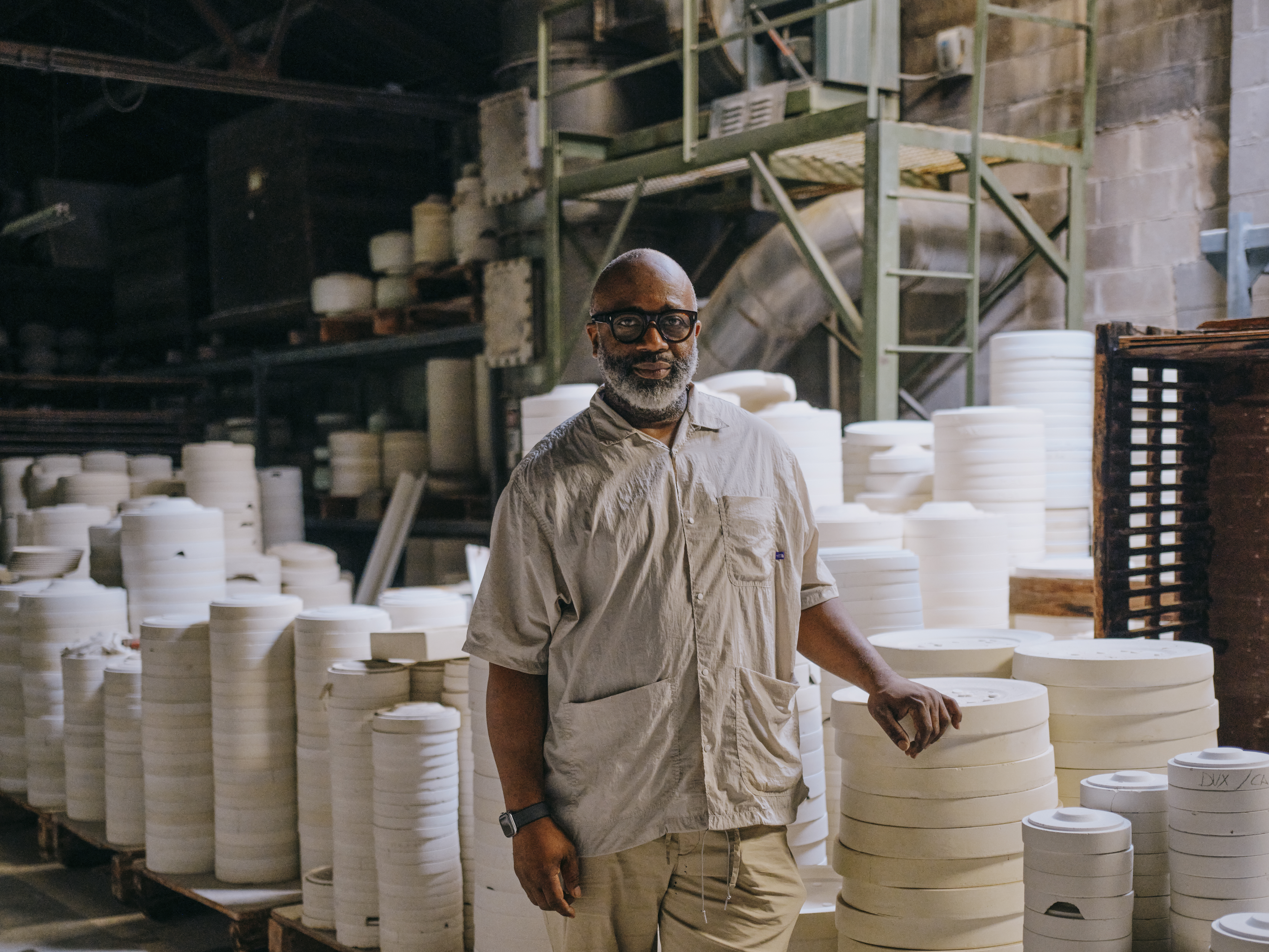 Theaster Gates poses for a portrait at the Pickard China factory in Antioch, Ill. The 53-year-old, Chicago-based artist recently acquired the business for an undisclosed sum.
