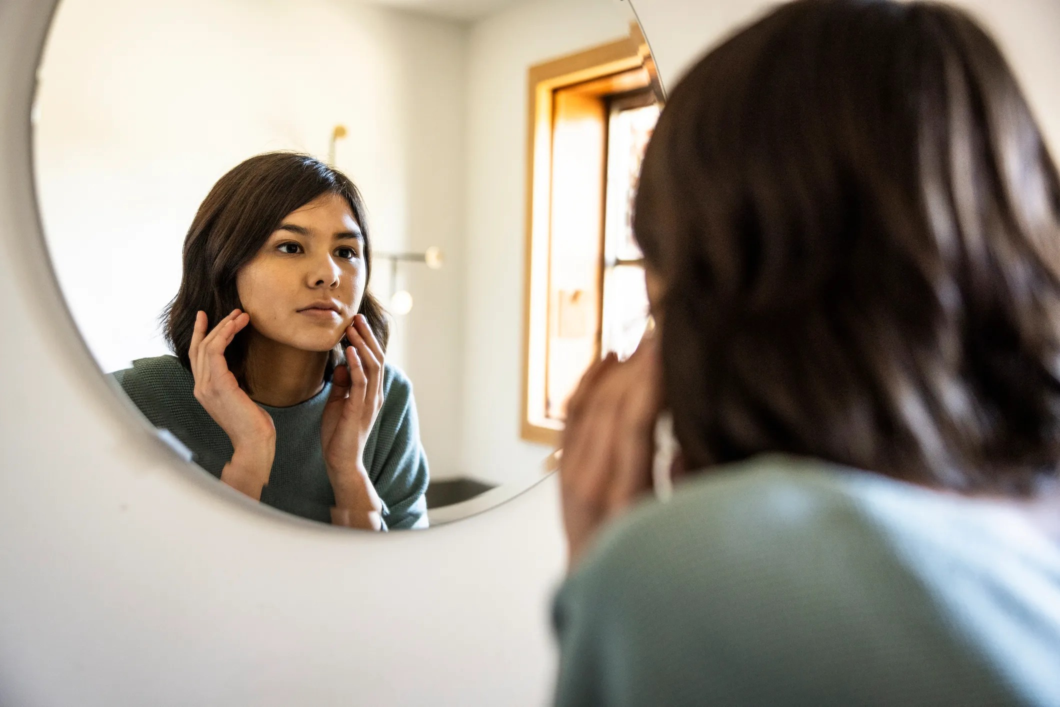 Person looking in mirror gettyimages